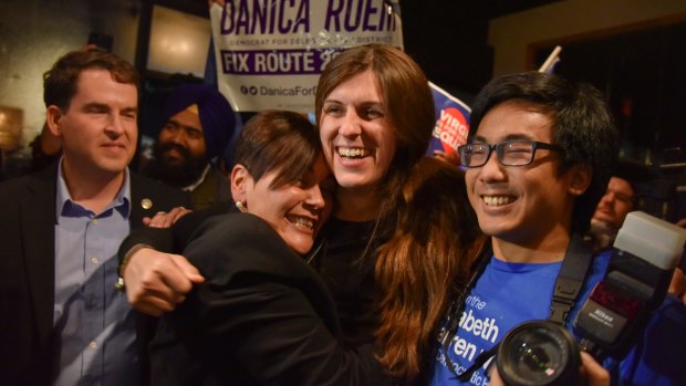 Danica Roem, centre, who ran for the house of delegates in Virginia became the first openly transgender in a state legislature in the United States.