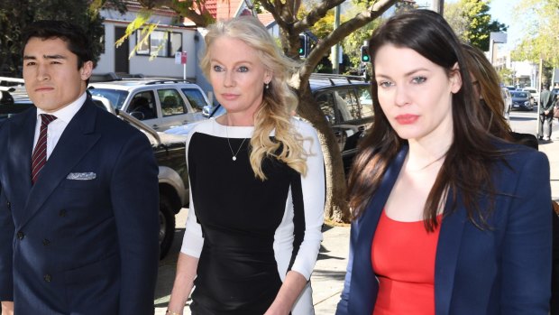 Sydney socialite Shari-Lea Hitchcock (centre) arrives with her legal representatives at   Waverley Local Court on Friday.