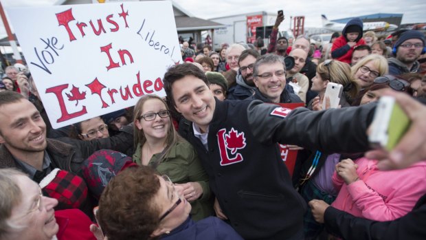 Liberal leader Justin Trudeau takes a selfie with supporters in Thunder Bay, Ontario, on Saturday.