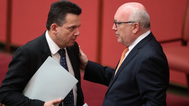 Senator Nick Xenophon with Attorney-General Senator George Brandis in the Sentate on Friday. 