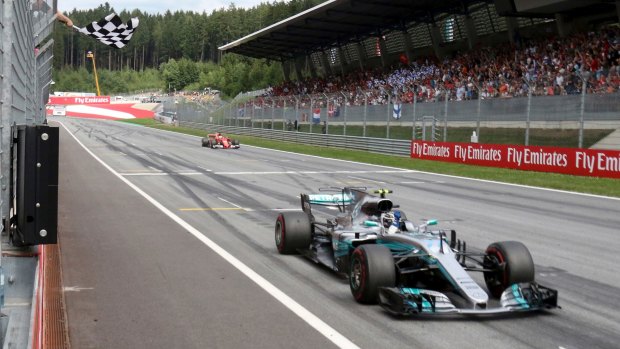 Mercedes driver Valtteri Bottas hangs on to win the Austrian Grand Prix.