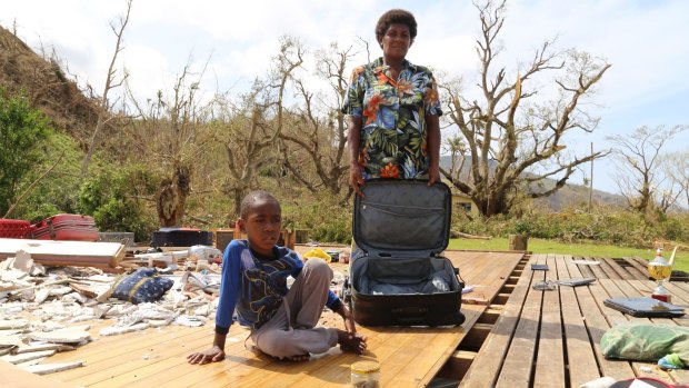 Salome Ululagi stands in the remains of her house destroyed by Tropical Cyclone Winston in Tavua Village, Koro Island, Fiji.   
