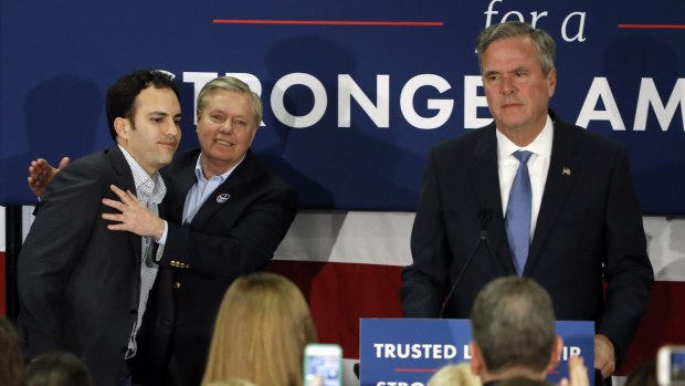 Jeb Bush, seen here with South Carolina senator Lindsey Graham and Jeb Bush jnr, has called time on his campaign.