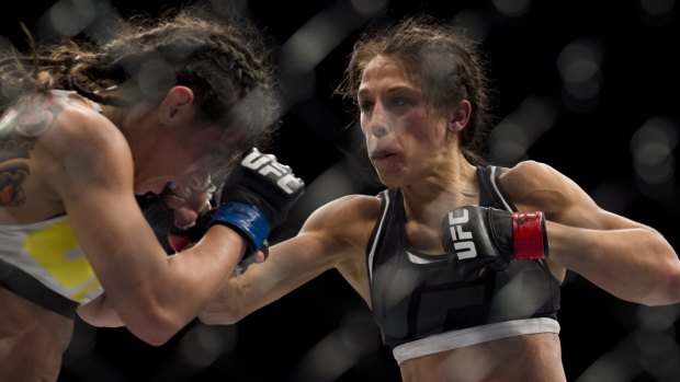 Joanna Jedrzejczyk throws a punch against Claudia Gadelha during The Ultimate Fighter Finale at MGM Grand Garden Arena on July 8, 2016.