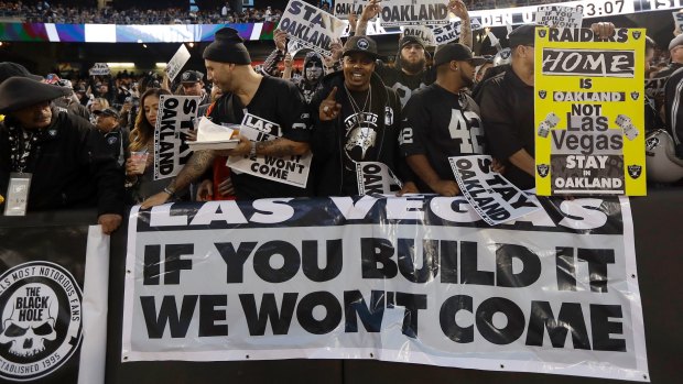 Not happy: Oakland Raiders fans let their feelings be known.
