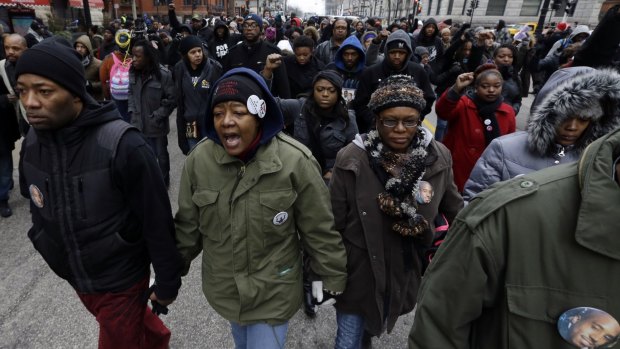 Dontre Hamilton's mother, Maria, leads the protest  in Milwaukee following the DA's decision to not charge the police officer who shot her son. 