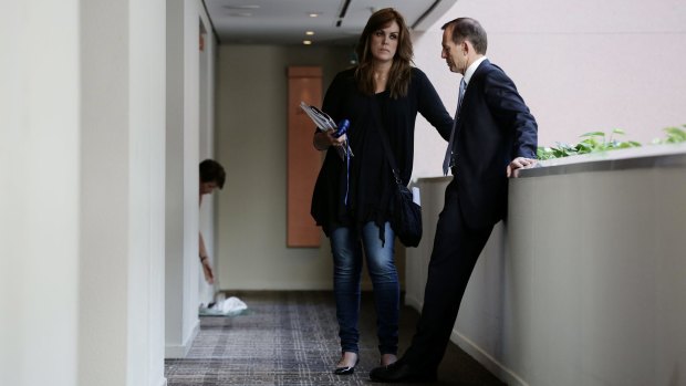 Tony Abbott in discussion with his chief of staff Peta Credlin.