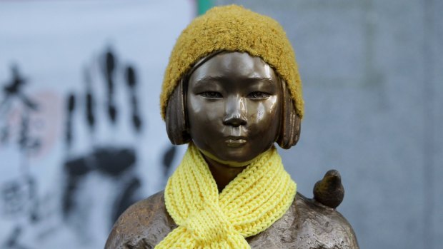 A statue of a girl symbolising the issue of "comfort women" in front of the Japanese Embassy in Seoul.
