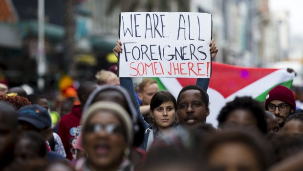 Hundreds of people participate in a peace march on Thursday after anti-immigrant violence flared in Durban.