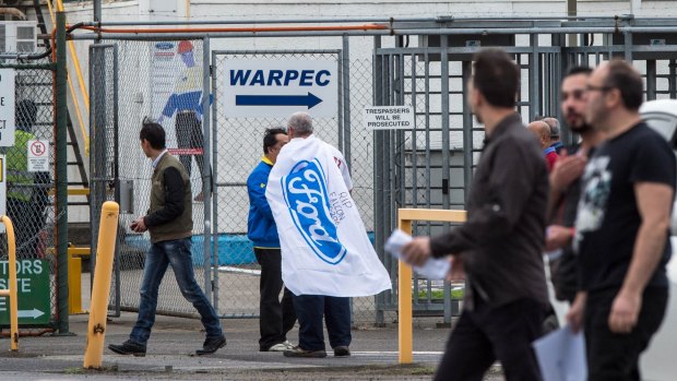 Sacked Ford workers leaving the Broadmeadows plant at the end of their last shift.