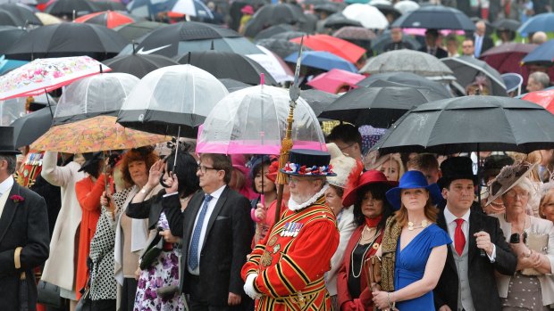 Guests attend a garden party at Buckingham Palace in London on Tuesday. Garden parties have been held at the palace since the 1860s.