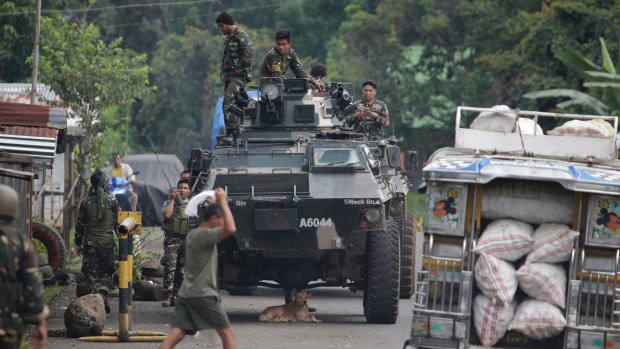 Soldiers prepare for deployment on the outskirts of Marawi city, southern Philippines. 