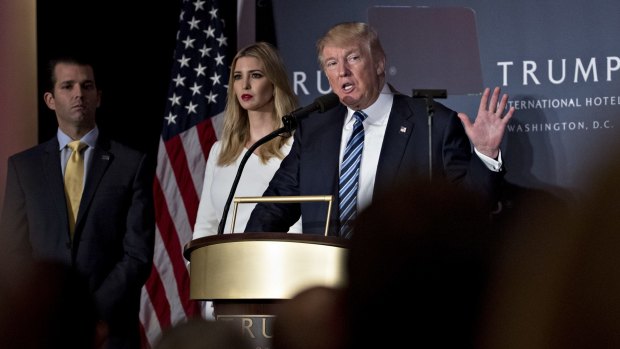 Donald Trump with daughter Ivanka Trump and son Donald Trump Jr.during the grand opening ceremony of the Trump International Hotel in Washington in October. The family's new hotel chain will be aimed at the crowds.