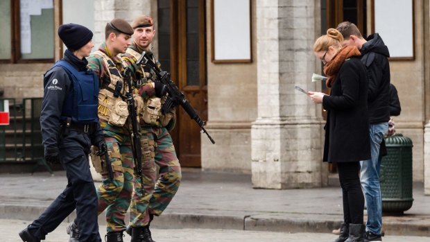 Belgian Army soldiers and a police officer patrol in the centre of Brussels on November 20. Salah Abdeslam, lived in the Belgium suburb of Molenbeek.