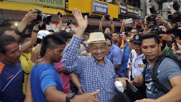 Former Malaysian PM Mahathir Mohamad joined anti-government protesters at a rally organised by pro-democracy group "Bersih" (Clean) in Kuala Lumpur in August.