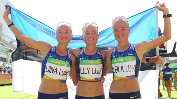 Seeing triple: Liina Luik, Lily Luik, and Leila Luik of Estonia after the women's marathon.