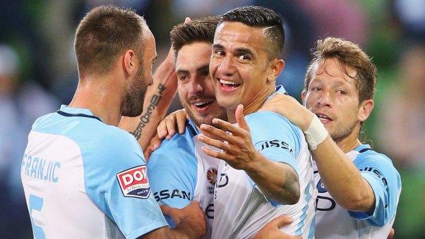 Warm em-brace: Bruno Fornaroli celebrates one of his two goals with Tim Cahill at AAMI Park. 