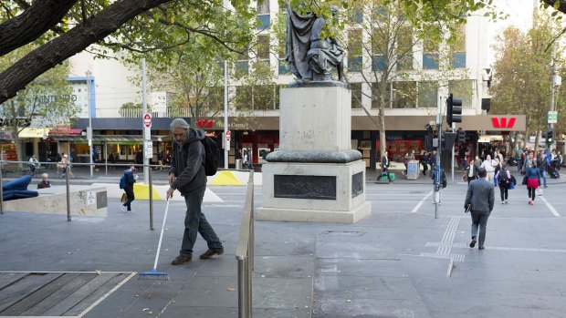 Cleaning up at City Square on Friday morning.