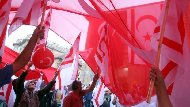 Turkish Cypriot demonstrators at the mass rally in support of Turkey's Prime Minister Recep Tayyip Erodgan.