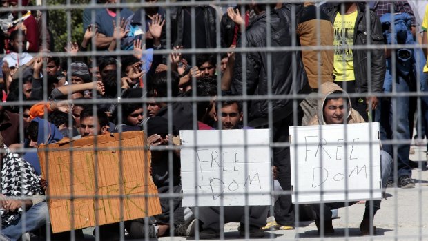 Afghan and Pakistani asylum seekers protest against their planned deportation to Turkey following an EU agreement with the Turkish authorities to tackle Europe's worsening mass migration crisis. 