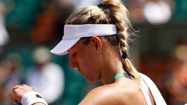 Early exit: Angelique Kerber became the first top seed to lose in the first round at Roland Garros in the Open era, which began in 1968.