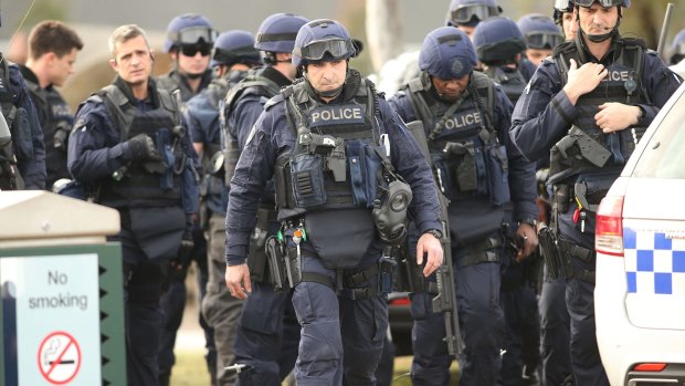 Police Special Operations Group members  outside the remand centre during the riot.
