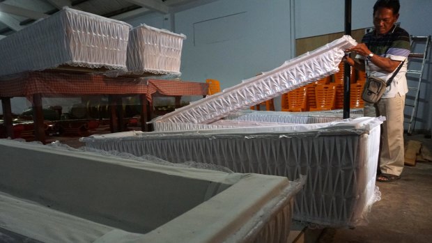 Coffins arrive at Cilacap prison. 
