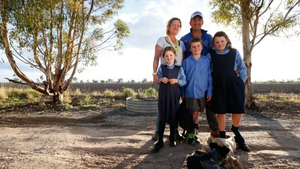 Bek and Jed Cullen with the children, Pippa, 6, Jock, 8 and Molly, 10, on the property near Walgett. 