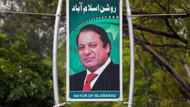 A billboard shows the portrait of Pakistani Prime Minister Nawaz Sharif displayed along a main highway in Islamabad, Pakistan.