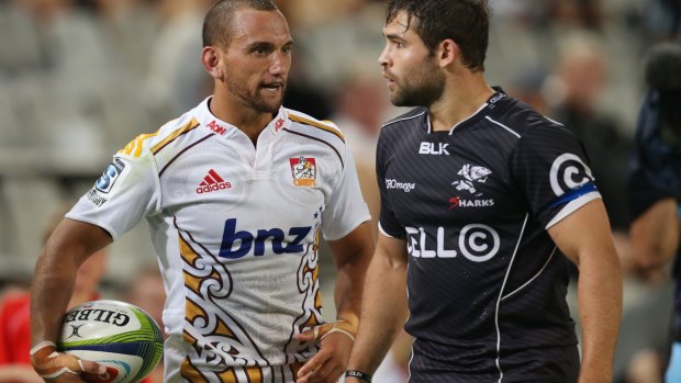 Ugly encounter:  Aaron Cruden of the Chiefs faces off with  Cobus Reinach of the Sharks.