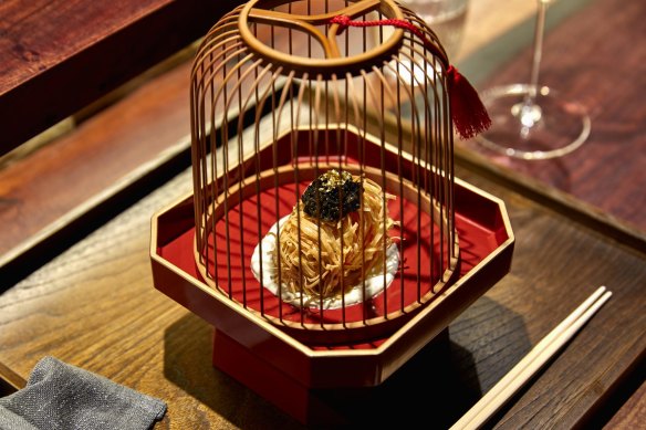 "Sea treasure" ball presented in a wooden birdcage.