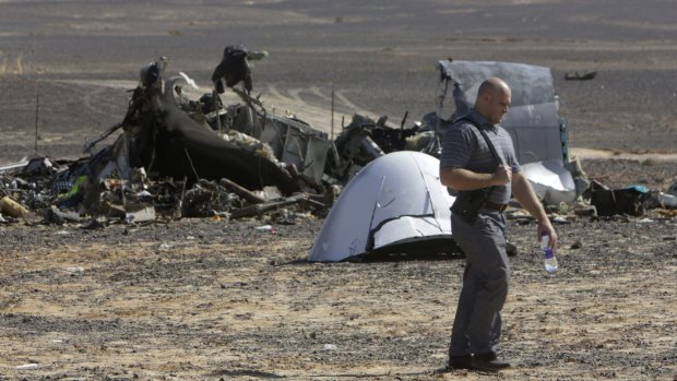 A Russian investigator inspects the Egyptian site where the plane crashed.