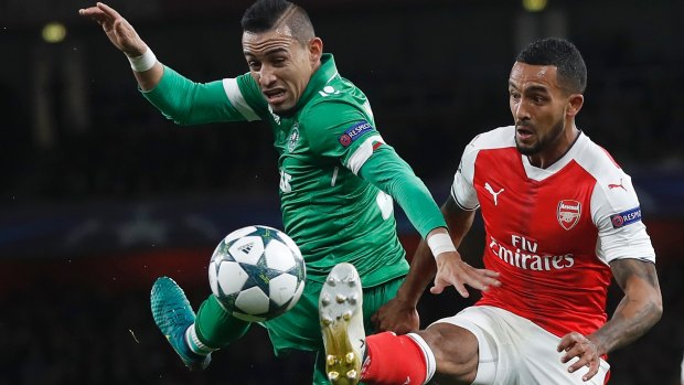 Ludogorets' Natanael, left, and Arsenal's Theo Walcott compete.