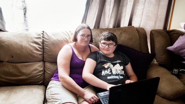 Kylie Fisher and her daughter Tahleah, 9, who has been helped to get a computer and internet access by the Smith Family. 	