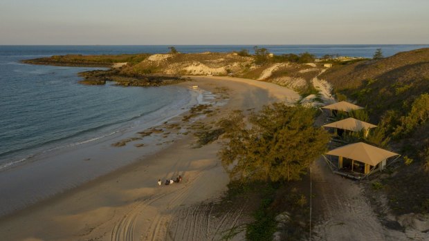 Banubanu Beach Retreat sits on a crescent-shaped white sand beach, lined with safari tents. 