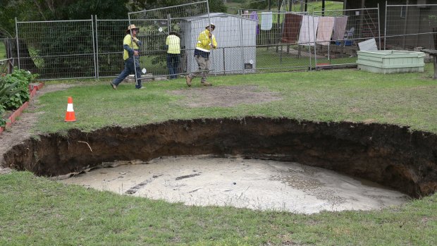 Water was being pumped out of the 12 metre wide sink hole.