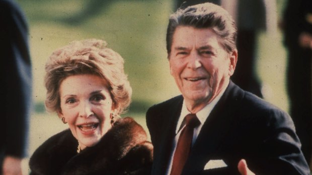 Nancy Reagan and president Reagan walk on the White House South lawn in 1986.