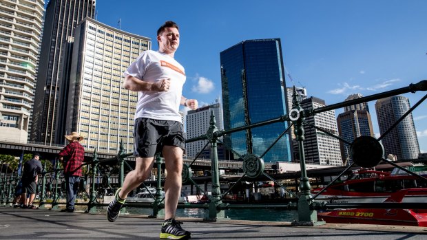 Neil Pennock prepares for the City2Surf at Circular Quay. He is hoping to raise the $60,000 needed to complete fitting out a room in a bone marrow ward.
