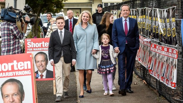 Old-fashioned people power: Bill Shorten votes in Marribyrnong with his wife Chloe and their family.