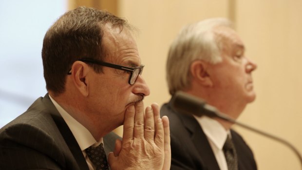 Michael Smith, 7-Eleven chairman, and Russell Withers, 7-Eleven owner, at the Senate inquiry in February.