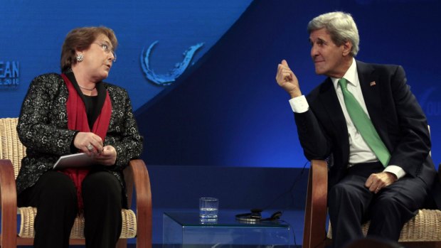 Chilean President Michelle Bachelet speaks with US Secretary of State John Kerry during the Our Ocean international conference on marine protection in Vina del Mar, Chile, on October 5.