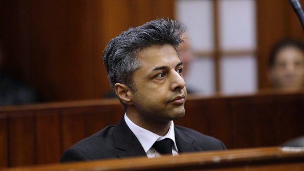 DENIAL: Shrien Dewani sits in the dock before the start of his trial in Cape Town.