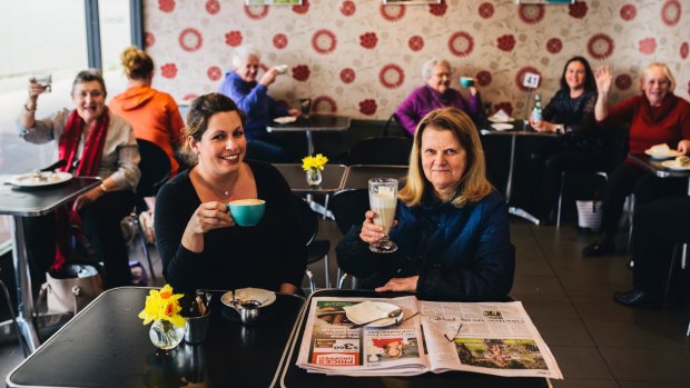 Customers at Sakeena's Cafe at Cooleman Court  celebrate news it will not be closing down with
Maria Stavrakis  (front left) who has run the business with her family, including parents Despina and Minas for more than 15 years.