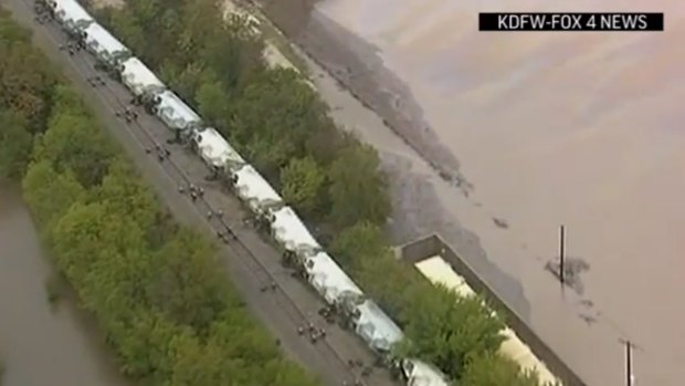 A freight train derailed by flash flooding  near Corsicana, Texas, about 80 kilometres south of Dallas.