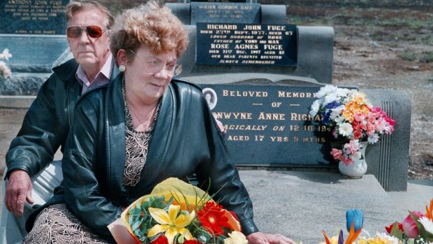 Distressed: Stan and Noelle Richardson visit their daughter Bronwynne's grave in 1998.