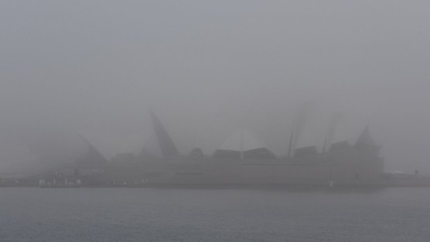 A thick fog shrouds the Sydney Opera House on Monday morning. 