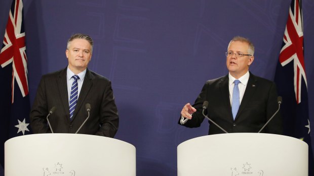 Finance Minister Mathias Cormann and Treasurer Scott Morrison unveil the slightly reduced deficit this week.