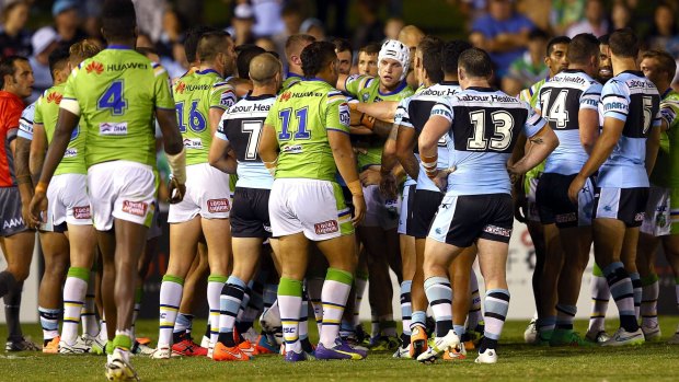 Blow up: Jack Wighton and Sosaia Feki get up close and personal in round one.