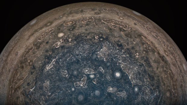 Jupiter's south pole, photographed from the Juno spacecraft, showing swirling cyclones of ammonia gas.