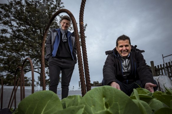 Rebecca Scott of STREAT and Rob Rees of Cultivating Community, pictured in the Collingwood Children's Farm garden beds that will be producing food for those in need.